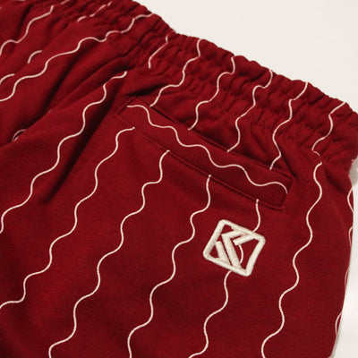 Karl Kani Small Signature Ziczac Pinstripe relaxed fit sweatpants dark red/off white - Shop-Tetuan
